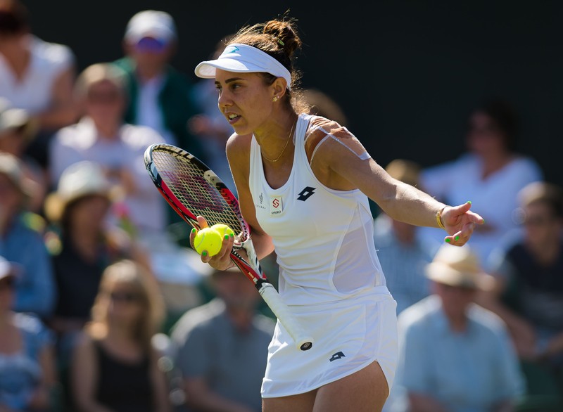 Mihaela Buzarnescu of Romania in action during her second-round match at the 2019 Wimbledon Championships Grand Slam Tennis Tournament against Simona Halep of Romania