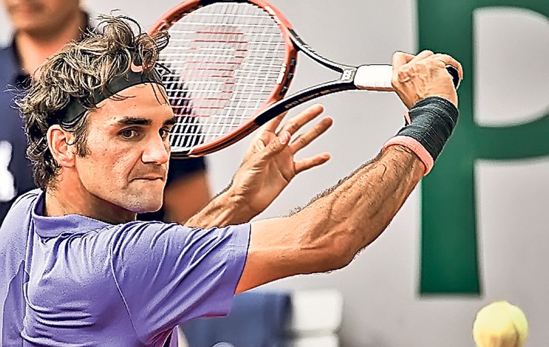 EXCLUSIV | Iohannis, cu racheta lui Federer!