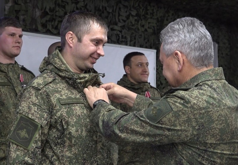 8383143 04.03.2023 In this handout video grab released by the Russian Defence Ministry, Russian Defence Minister Sergei Shoigu, right, awards Russian servicemen as part of an inspection work of the group of Russian forces Vostok taking part in the military operation in Ukraine, at the unknown location. Editorial use only, no archive, no commercial use. Russian Defence Ministry,Image: 760237505, License: Rights-managed, Restrictions: *** HANDOUT image or SOCIAL MEDIA IMAGE or FILMSTILL for EDITORIAL USE ONLY! * Please note: Fees charged by Profimedia are for the Profimedia's services only, and do not, nor are they intended to, convey to the user any ownership of Copyright or License in the material. Profimedia does not claim any ownership including but not limited to Copyright or License in the attached material. By publishing this material you (the user) expressly agree to indemnify and to hold Profimedia and its directors, shareholders and employees harmless from any loss, claims, damages, demands, expenses (including legal fees), or any causes of action or allegation against Profimedia arising out of or connected in any way with publication of the material. Profimedia does not claim any copyright or license in the attached materials. Any downloading fees charged by Profimedia are for Profimedia's services only. * Handling Fee Only ***, Editors' note: THIS IMAGE IS PROVIDED BY RUSSIAN STATE-OWNED AGENCY SPUTNIK., Model Release: no