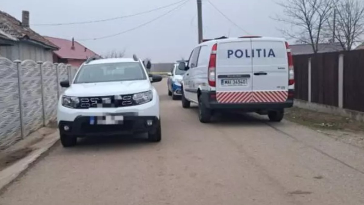 Mașini de poliție, parcate pe o stradă