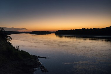 NO WEB/NO APPS - Exclusive. (Text available) View of a sunset over the Madre de Dios river seen from the 'Palma Real' native community, near Puerto Maldonado, Peru on July 17, 2017. The Amazon rainforest is famous as The Lung of the Earth, but also for the presence of numerous native communities, who have always lived isolated and in close contact with nature for generations, used to seek for food and medicines and to build items directly from the environment in which they live. The unstoppable rise of globalization has drastically changed their needs, expectations and consequently their way of life. Located in the Tambopata National Reserve, on the border between Peru and Bolivia, the native Comunidad Palma Real is one of the clearest examples of this change. Living on the banks of the Madre de Dios River since approximately 1976, Palma Real comprises about 300 people part of the nomadic community Ese-Eja, established in the Amazon rainforest of Peru before the Spanish colonization. Photo by Giacomo d'Orlando/ABACAPRESS.COM