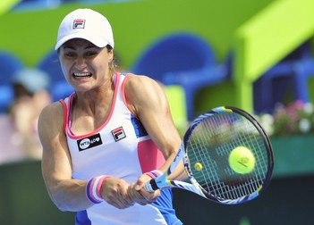 Romanian player, Monica Niculescu, returns the ball to Hungarian Timea Babos, during the Monterrey Open, in Monterrey, Mexico, 05 April 2013. EPA/Miguel Sierra