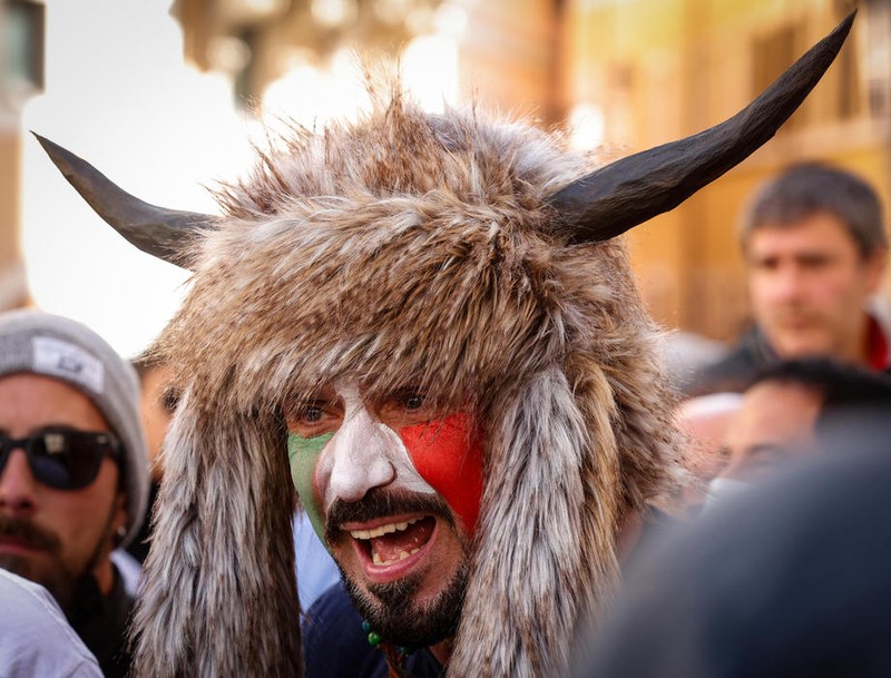epa09118765 A participant in costume shouts slogans as traders, shopkeepers and restaurateurs clash with police during a protest next to the Chamber of Deputies in Piazza Montecitorio, in Rome, Italy, 06 April 2021. The protesters, many with lowered masks, demand the reopening of their shops and restaurants amid the third COVID-19 pandemic lockdown measures. EPA-EFE/GIUSEPPE LAMI