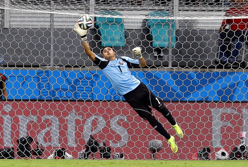 epa04301722 Costa Rica's goalkeeper Keilor Navas in action during the FIFA World Cup 2014 quarter final match between the Netherlands and Costa Rica at the Arena Fonte Nova in Salvador, Brazil, 05 July 2014. (RESTRICTIONS APPLY: Editorial Use Only, not used in association with any commercial entity - Images must not be used in any form of alert service or push service of any kind including via mobile alert services, downloads to mobile devices or MMS messaging - Images must appear as still images and must not emulate match action video footage - No alteration is made to, and no text or image is superimposed over, any published image which: (a) intentionally obscures or removes a sponsor identification image; or (b) adds or overlays the commercial identification of any third party which is not officially associated with the FIFA World Cup) EPA/CHEMA MOYA EDITORIAL USE ONLY