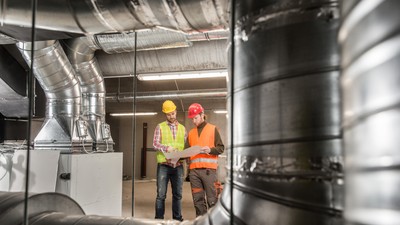 Workers,Making,Final,Touches,To,Hvac,System.,Hvac,System,Stands