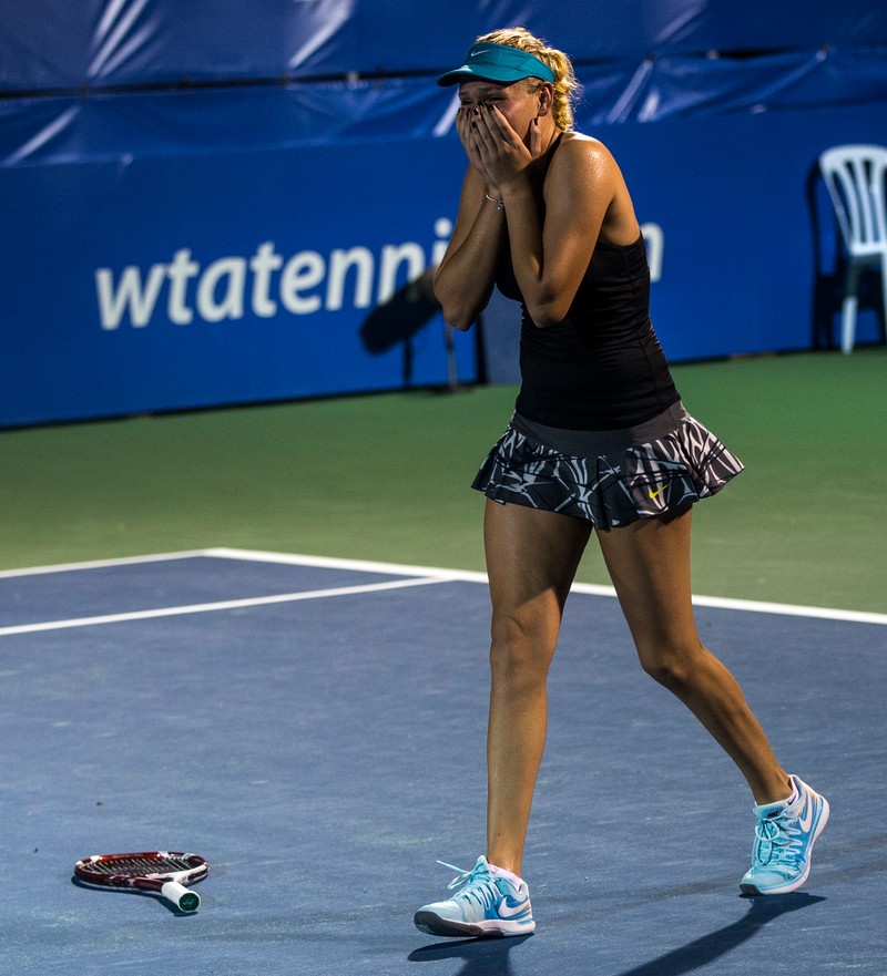 epa04173957 Donna Vekic of Croatia reacts after winning the final match of the WTA Malaysian Open tennis tournament against Dominika Cibulkova of Slovakia in Kuala Lumpur, Malaysia, 20 April 2014. EPA/AHMAD YUSNI