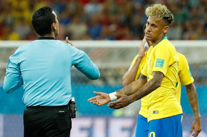 epa06816972 Neymar (R) of Brazil listens to Mexican refereee Cesar Ramos during the FIFA World Cup 2018 group E preliminary round soccer match between Brazil and Switzerland in Rostov-On-Don, Russia, 17 June 2018. (RESTRICTIONS APPLY: Editorial Use Only, not used in association with any commercial entity - Images must not be used in any form of alert service or push service of any kind including via mobile alert services, downloads to mobile devices or MMS messaging - Images must appear as still images and must not emulate match action video footage - No alteration is made to, and no text or image is superimposed over, any published image which: (a) intentionally obscures or removes a sponsor identification image; or (b) adds or overlays the commercial identification of any third party which is not officially associated with the FIFA World Cup) EPA-EFE/SHAWN THEW EDITORIAL USE ONLY