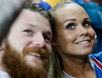 epa05406436 Aron Gunnarsson (L) of Iceland and his partner Kristbjoerg Jonasdottir at the end of the UEFA EURO 2016 quarter final match between France and Iceland at Stade de France in Saint-Denis, France, 03 July 2016. Iceland lost the match 2-5. (RESTRICTIONS APPLY: For editorial news reporting purposes only. Not used for commercial or marketing purposes without prior written approval of UEFA. Images must appear as still images and must not emulate match action video footage. Photographs published in online publications (whether via the Internet or otherwise) shall have an interval of at least 20 seconds between the posting.) EPA/ETIENNE LAURENT EDITORIAL USE ONLY