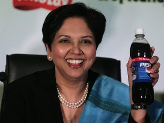 President and CEO of PepsiCo, Indra K. Nooyi holds a bottle of Pepsi during a press conference in New Delhi, 18 December 2006. Seeking to completely undo the damage done by a pesticide controversy, global food and beverages giant PepsiCo said it gave safety and integrity of products the single-highest priority and would fully comply with whatever standards India sets. "I personally stand behind each and every product we sell. In my view, they are the best in the world," Pepsico's President and CEO Indra Nooyi said in her first press interaction outside the US after taking charge at the helm of the 33-billion dollar MNC.,Image: 19794737, License: Rights-managed, Restrictions: , Model Release: no