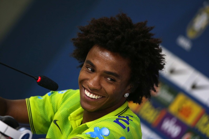 epa04302889 Brazil's soccer player Willian speaks during a press conference at Granja Comary in Teresopolis, Brazil, 06 July 2014. Brazil will face Germany as part of semifinals of FIFA World Cup 2014 on 08 July. EPA/MARCELO SAYAO