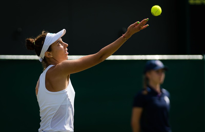 Mihaela Buzarnescu of Romania in action during her second-round match at the 2019 Wimbledon Championships Grand Slam Tennis Tournament against Simona Halep of Romania