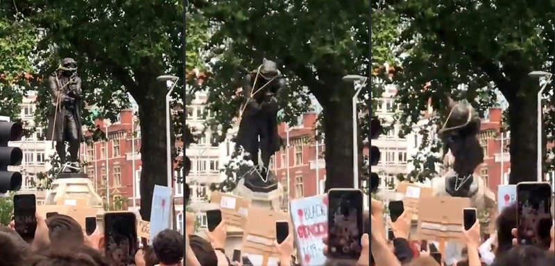 Protestatarii au dat jos statuia de pe soclu. Foto: Profimedia