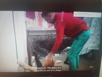 Vasile Mutu chopping wood with an axe, in the NYT story | Photo: NYT documentary still