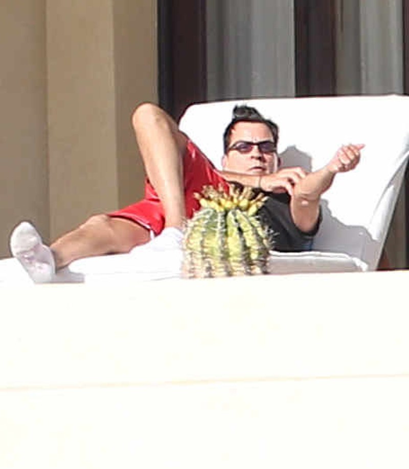 Exclusive... 51952766 Actor Charlie Sheen is seen relaxing on his balcony while vacationing in Cabo San Lucas, Mexico on January 21, 2016. Charlie is having a tough time lately, first it was his HIV positive admission and now his ex-wife Denise Richards is suing him, claiming that he is taking money out of their daughters trust funds that he made for them. ***NO WEB USE W/O PRIOR AGREEMENT - CALL FOR PRICING*** FameFlynet, Inc - Beverly Hills, CA, USA - +1 (310) 505-9876