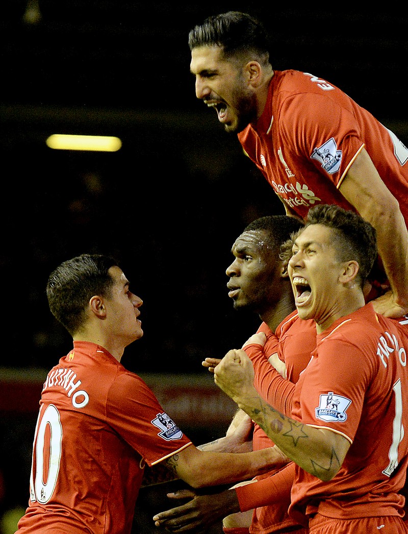 epa05081308 Liverpool players celebrate with Christian Benteke after he scores the opening goal during the English Premier League soccer match between Liverpool and Leicester City at Anfield, Liverpool, Britain, 26 December 2015. EPA/PETER POWELL EDITORIAL USE ONLY. No use with unauthorized audio, video, data, fixture lists, club/league logos or 'live' services. Online in-match use limited to 75 images, no video emulation. No use in betting, games or single club/league/player publications