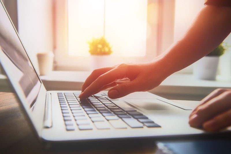 Business woman working at office with laptop