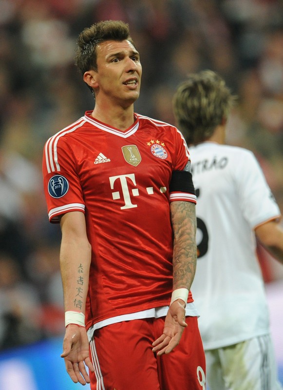 epa04185585 Munich's Mario Mandzukic reacts during the UEFA Champions League semi-final second leg match between FC Bayern Munich and Real Madrid in Munich, Germany, 29 April 2014. EPA/ANDREAS GEBERT