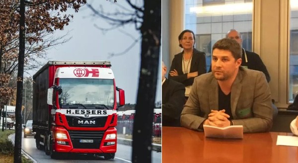 Un bărbat cu mâinile pe o masă, în dreapta, și un camion cu cabină vopsită roșu și alb, în stânga