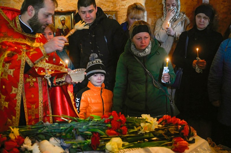 April 30, 2023, Uman, Ukraine: Close relatives and friends attend the funeral ceremony of Shulga Sofia, 11 years old, and her brother Pisarev Kiryusha, 17 years old, who died as a result of a Russian missile attack on a multi-storey residential building in Uman.,Image: 773049016, License: Rights-managed, Restrictions: , Model Release: no