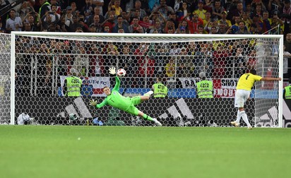 epa06862500 Goalkeeper Jordan Pickford of England saves the penalty of Carlos Bacca of Colombia during the penalty shootout during the FIFA World Cup 2018 round of 16 soccer match between Colombia and England in Moscow, Russia, 03 July 2018. (RESTRICTIONS APPLY: Editorial Use Only, not used in association with any commercial entity - Images must not be used in any form of alert service or push service of any kind including via mobile alert services, downloads to mobile devices or MMS messaging - Images must appear as still images and must not emulate match action video footage - No alteration is made to, and no text or image is superimposed over, any published image which: (a) intentionally obscures or removes a sponsor identification image; or (b) adds or overlays the commercial identification of any third party which is not officially associated with the FIFA World Cup) EPA-EFE/FACUNDO ARRIZABALAGA EDITORIAL USE ONLY