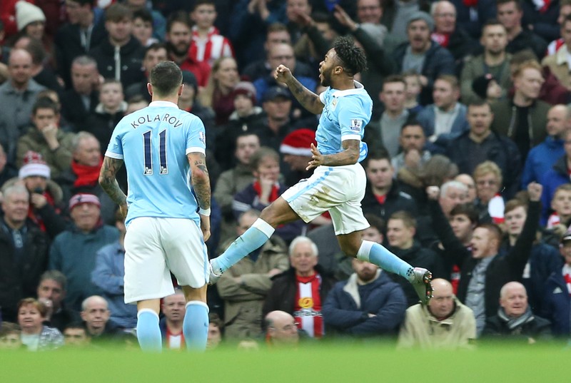 epa05081277 Manchester City's Raheem Sterling (R) celebrates scoring during the English Premier League soccer match between Manchester City and Sunderlandl at the Etihad Stadium, Manchester, Britain, 26 December 2015. EPA/Nigel Roddis EDITORIAL USE ONLY. No use with unauthorized audio, video, data, fixture lists, club/league logos or 'live' services. Online in-match use limited to 75 images, no video emulation. No use in betting, games or single club/league/player publications.