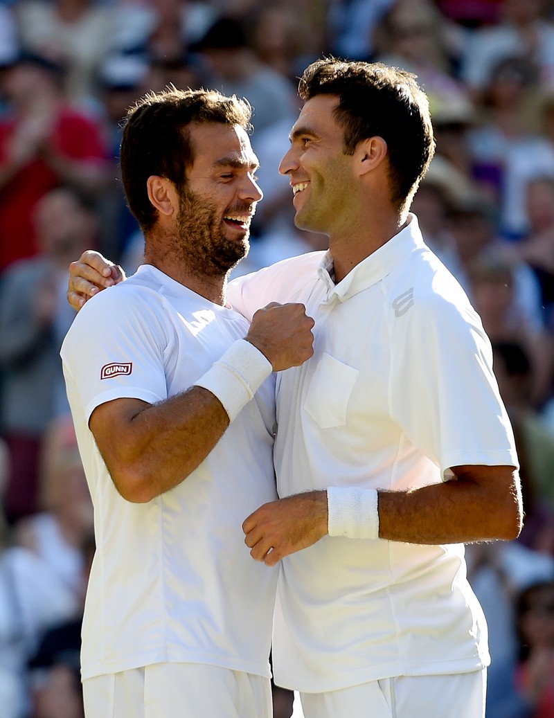 epa04842892 Horia Tecau (R) of Romania and Jean-Julien Rojer of the Netherlands celebrate winning the Men's doubles final match against Jamie Murray of Britain and John Peers of Australia during the Wimbledon Championships at the All England Lawn Tennis Club, in London, Britain, 11 July 2015. EPA/FACUNDO ARRIZABALAGA EDITORIAL USE ONLY/NO COMMERCIAL SALES
