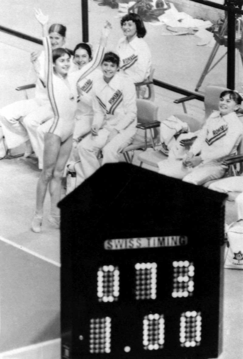 Romanian gymnast Nadia Comaneci jumps up with her arms in the air during the Women's Gymnastic preliminaries at the XXI Olympic Games in Montreal, Canada on July 20, 1976, after she had achieved another perfect score of ten points.,Image: 587307490, License: Rights-managed, Restrictions: This content is intended for editorial use only. For other uses, additional clearances may be required. WIRE PHOTO, Model Release: no , Pictured: Nadia Comaneci
