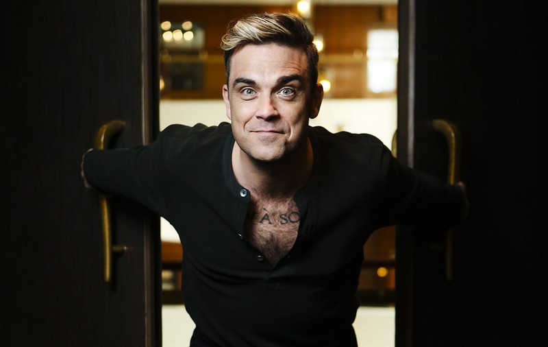 Fiţe de vedetă! Ce le-a cerut Robbie Williams organizatorilor concertului din România. Va avea 280 de prosoape şi 48 de ouă