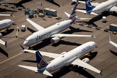 epa08892946 (FILE) - An aerial view of Boeing 737 Max 8 aircraft owned by American Airlines and United Airlines parked at Boeing Field in Seattle, Washington, USA, 21 July 2019 (reissued 19 December 2020). According to US Senate investigators Boeing officials inappropriately coached test pilots during the 737 Max aircraft recertification process. EPA-EFE/GARY HE EDITORIAL USE ONLY