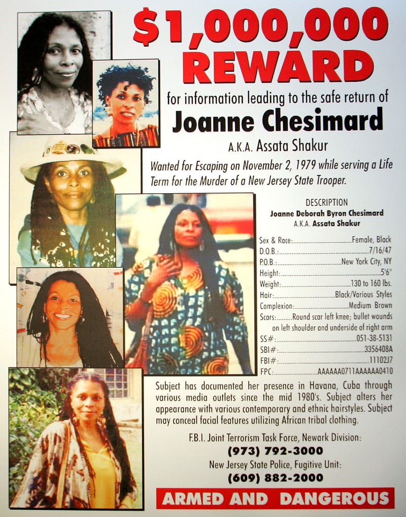 FILE - A reward poster announcing the federal bounty for the capture of convicted killer Joanne Chesimard, who used the name Assata Shakur, seen in West Trenton, N.J. on Monday, May 2, 2005.,Image: 1040637038, License: Rights-managed, Restrictions: This content is intended for editorial use only. For other uses, additional clearances may be required. FILE PHOTO, Model Release: no, Pictured: Joanne Chesimard