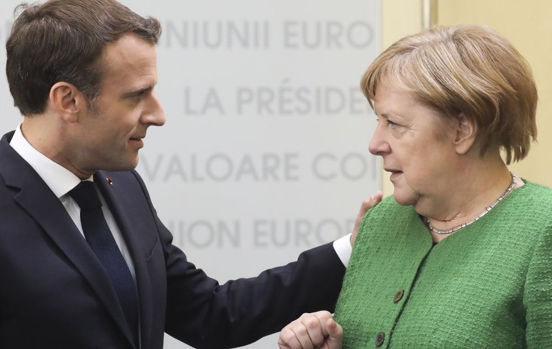 Emmanuel Macron ar susţine-o pe Angela Merkel dacă ea ar candida la conducerea Comisiei Europene