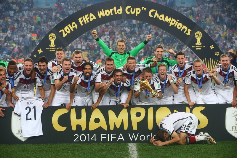 epa04315022 Germany's players celebrate with the trophy after winning the FIFA World Cup 2014 final between Germany and Argentina at the Estadio do Maracana in Rio de Janeiro, Brazil, 13 July 2014. (RESTRICTIONS APPLY: Editorial Use Only, not used in association with any commercial entity - Images must not be used in any form of alert service or push service of any kind including via mobile alert services, downloads to mobile devices or MMS messaging - Images must appear as still images and must not emulate match action video footage - No alteration is made to, and no text or image is superimposed over, any published image which: (a) intentionally obscures or removes a sponsor identification image; or (b) adds or overlays the commercial identification of any third party which is not officially associated with the FIFA World Cup) EPA/DIEGO AZUBEL EDITORIAL USE ONLY