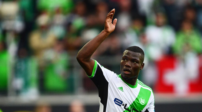 epa04164681 Wolfsburg's Junior Malanda celebrates after scoring the 3-1 lead during the German Bundesliga soccer match between VfL Wolfsburg and FC Nuernberg in Wolfsburg, Germany, 12 April 2014. Wolfsburg won 4-1. (ATTENTION: Due to the accreditation guidelines, the DFL only permits the publication and utilisation of up to 15 pictures per match on the internet and in online media during the match.) EPA/PETER STEFFEN