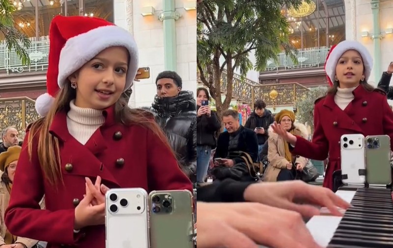 Momentul în care o fetiță începe să cânte un colind într-o gară aglomerată din Paris: toți călătorii se opresc și o ascultă uimiți