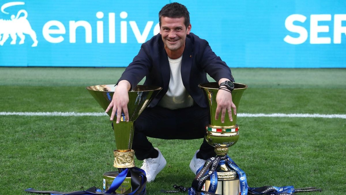 MILAN, ITALY - MAY 17: FC Internazionale coach Cristian Chivu poses for a photo with the Coppa Campioni d'Italia and Coppa Italia trophies following the Serie A match between FC Internazionale and Hellas Verona FC at Giuseppe Meazza Stadium on May 17, 2026 in Milan, Italy. (Photo by Marco Luzzani/Getty Images)