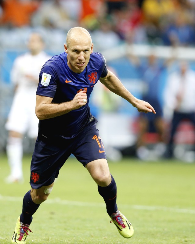 epa04254731 Arjen Robben of the Netherlands reacts after scoring the 1:2 lead during the FIFA World Cup 2014 group B preliminary round match between Spain and the Netherlands at the Arena Fonte Nova in Salvador, Brazil, 13 June 2014. (RESTRICTIONS APPLY: Editorial Use Only, not used in association with any commercial entity - Images must not be used in any form of alert service or push service of any kind including via mobile alert services, downloads to mobile devices or MMS messaging - Images must appear as still images and must not emulate match action video footage - No alteration is made to, and no text or image is superimposed over, any published image which: (a) intentionally obscures or removes a sponsor identification image; or (b) adds or overlays the commercial identification of any third party which is not officially associated with the FIFA World Cup) EPA/GUILLAUME HORCAJUELO EDITORIAL USE ONLY