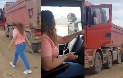 Georgiana, o soferita imbracata in tricou roz si blugi, care conduce o basculanta rosie 