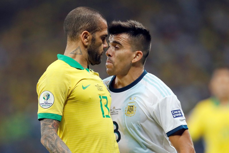 Brazil's Dani Alves (L) argues with Argentina's Marcos Acuna (R) during the Copa America 2019 semi-finals soccer match between Brazil and Argentina at Mineirao Stadium in Belo Horizonte, Brazil, 02 July 2019. EPA-EFE/Antonio Lacerda