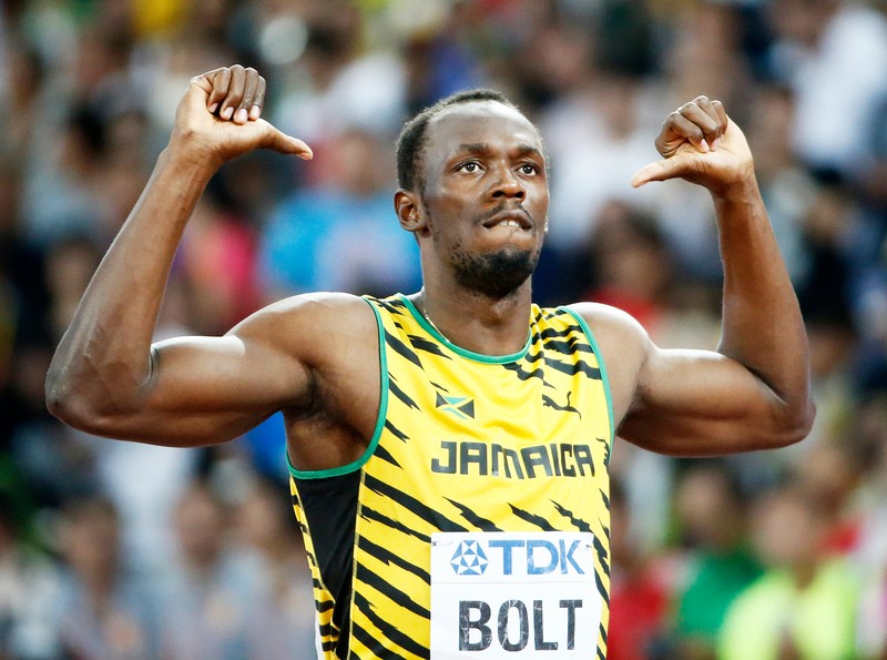 epa04894267 Jamaica's Usain Bolt gestures before the start of the men's 100m semi final of the Beijing 2015 IAAF World Championships at the National Stadium, also known as Bird's Nest, in Beijing, China, 23 August 2015. EPA/DIEGO AZUBEL