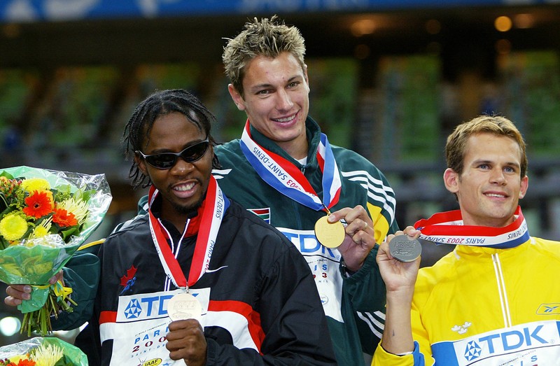 Men's high jump gold medal winner Jacques Freitag (C) of South Africa, silver medal winner Stefan Holm of Sweden (R) and bronze winner Mark Boswell of Canada pose on the podium 26 August 2003 during the 9th Athletics World Championships at the Stade de France in Saint-Denis, outside Paris. Freitag was the only man to go clear at 2.35 metres in the competition and he became just the third South African to win at the World Championships.AFP PHOTO JACK GUEZ,Image: 72304787, License: Rights-managed, Restrictions: DV, Model Release: no