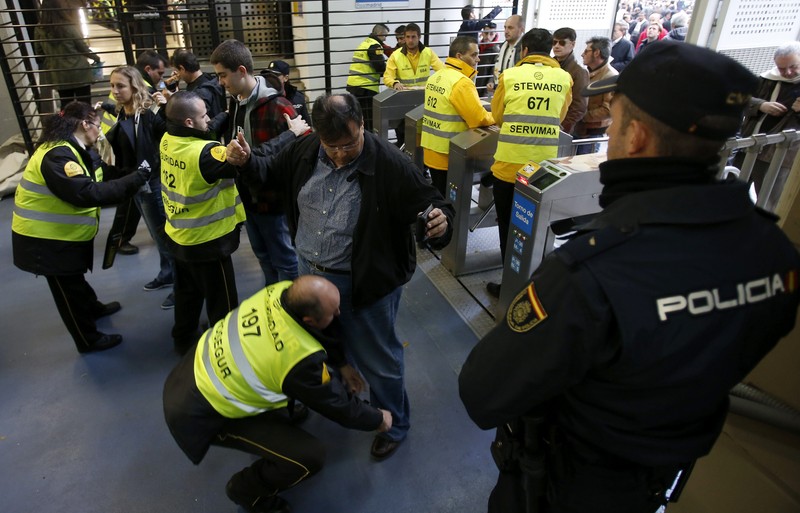 epa05036114 Stewards and security members frisk people at the entry of Santiago Bernabeu stadium in Madrid, Spain, 21 November 2015, before the starting of Spanish Liga Primera Division soccer match between Real Madrid and FC Barcelona. Exceptional tight security measures are taken for the match after the 13 November recent terrorist attacks in Paris. A total of 1,200 policemen, six times more than normally, 120 local policemen and 1,195 Real Madrid's private security guards, attend the match. EPA/CHEMA MOYA