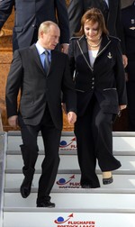 The Russian President Vladimir Putin and his wife Ludmila Putina leave the airplane at Rostock-Laage airport, Germany, 06 June 2007. Most G8 heads of states will be arriving at Rostock-Laage to take part in the G8 summit taking place under intense security measures until 8th June in nearby Heiligendamm. Photo: Oliver Berg,Image: 85909062, License: Rights-managed, Restrictions: , Model Release: no