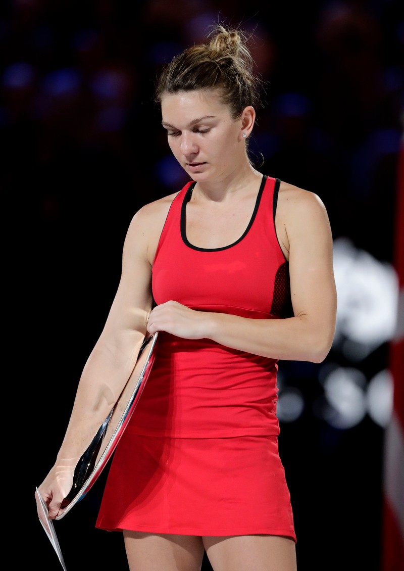 epa06478000 Simona Halep of Romania reacts after being defeated in her women's singles final match by Caroline Wozniacki of Denmark at the Australian Open Grand Slam tennis tournament in Melbourne, Australia, 27 January 2018. EPA-EFE/MARK CRISTINO
