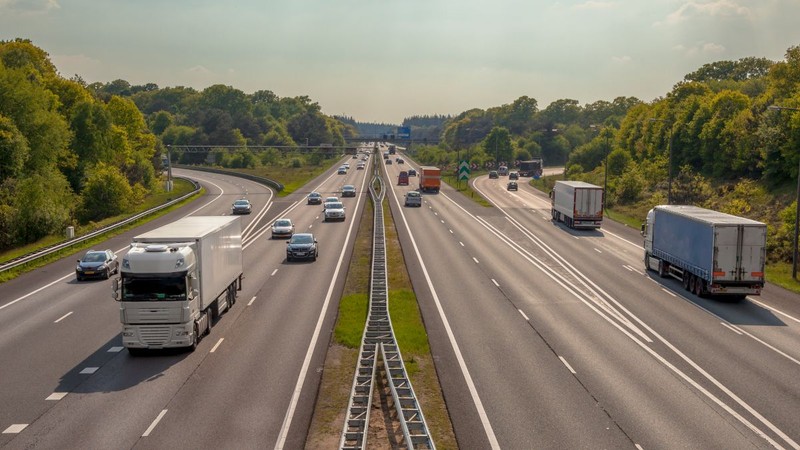 Right hand side Evening Traffic on the A12 Motorway through the Veluwe forest. One of the Bussiest highways in the Netherlands