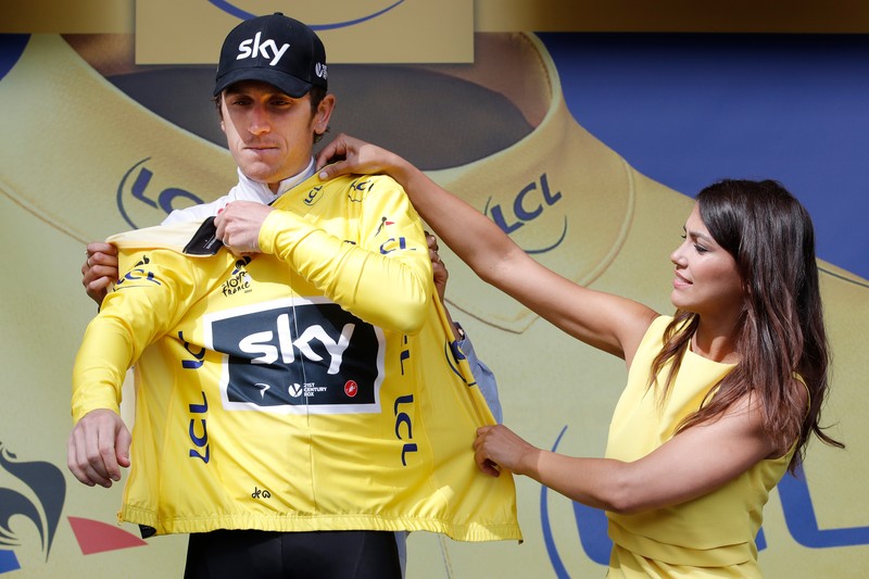 epa06061995 Team Sky rider Geraint Thomas of Great Britain celebrates on the podium retaining the overall leader's yellow jersey following the 2nd stage of the 104th edition of the Tour de France cycling race over 203.5 km between Duesseldorf and Liege, Belgium, 02 July 2017. EPA/ROBERT GHEMENT