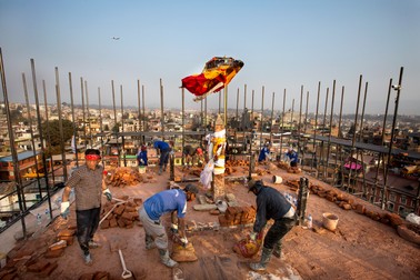 epa05247270 (38/45) Group of Buddhist pilgrims work on the reconstruction on the top side of the Bauddha Stupa, a heritage site listed on a UNESCO World Heritage Sites, in Kathmandu, Nepal, 23 February 2016. The Stupa was damaged during the Earthquake on 25 April 2016. Millions of Nepalese are still struggling with the harsh reality of 25 April 2015 when a 7.9-magnitude earthquake struck the nation. It killed more than 9,000 people, injured at least 23,000, wiped out 200,000 homes, 20,000 schools and destroyed more than 700 monuments. EPA/NARENDRA SHRESTHA PLEASE REFER TO ADVISORY NOTICE (epa05247232) FOR FULL FEATURE TEXT