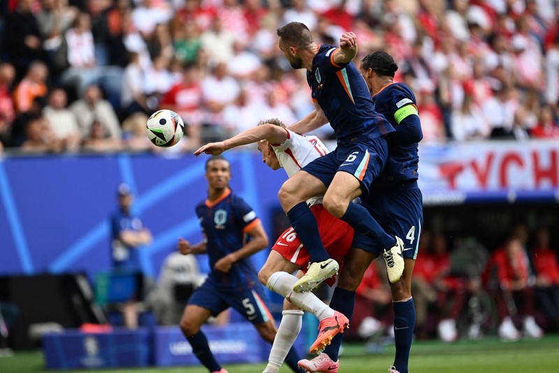 HAMBURG, GERMANY - JUNE 16: Stefan de Vrij (6) of Netherlands in action against Adam Buksa (16) during the 2024 European Football Championship (EURO 2024) Group D football match between Poland and Netherlands at Volksparkstadion Hamburg in Hamburg, Germany on June 16, 2024. Halil Sagirkaya / Anadolu/ABACAPRESS.COM