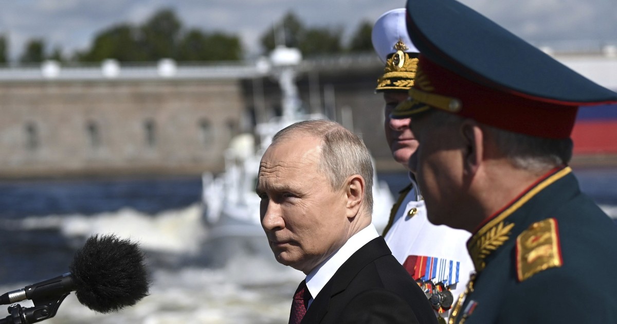 July 30, 2023, St Petersburg, Leningrad Oblast, Russia: Russian President Vladimir Putin, left, reviews the parade of naval vessels accompanied by Russian Defence Minister Sergei Shoigu, right, and Naval Commander Nikolai Yevmenov, center, onboard the naval cutter Raptor on the Neva River, July 30, 2023 in St. Petersburg, Russia. (Credit Image: © Alexander Kazakov/Kremlin Pool/Planet Pix via ZUMA Press Wire)