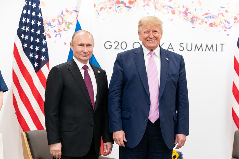 FILED - 14 June 2019, Japan, Osaka: US President Donald Trump (R) and Russian President Vladimir Putin pose for a picture during their meeting on the sidelines of the G20 summit. Photo: -/White House/dpa - ATTENTION: editorial use only and only if the credit mentioned above is referenced in full