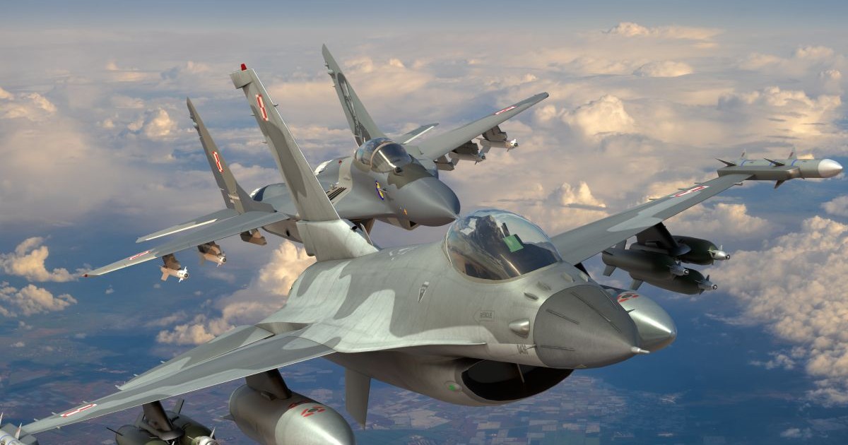 In imagine doua avioane militare in zbor, Lockheed Martin F-16 al Forțelor Aeriene Poloneze într-un zbor comun cu Mig-29